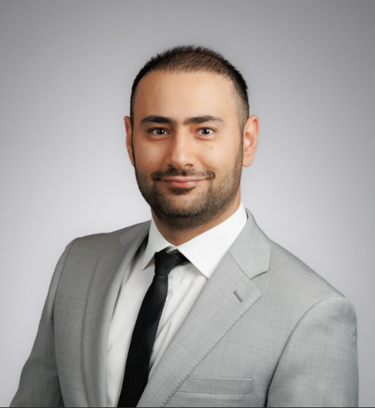 Headshot of Iman Sadeghi, smiling.