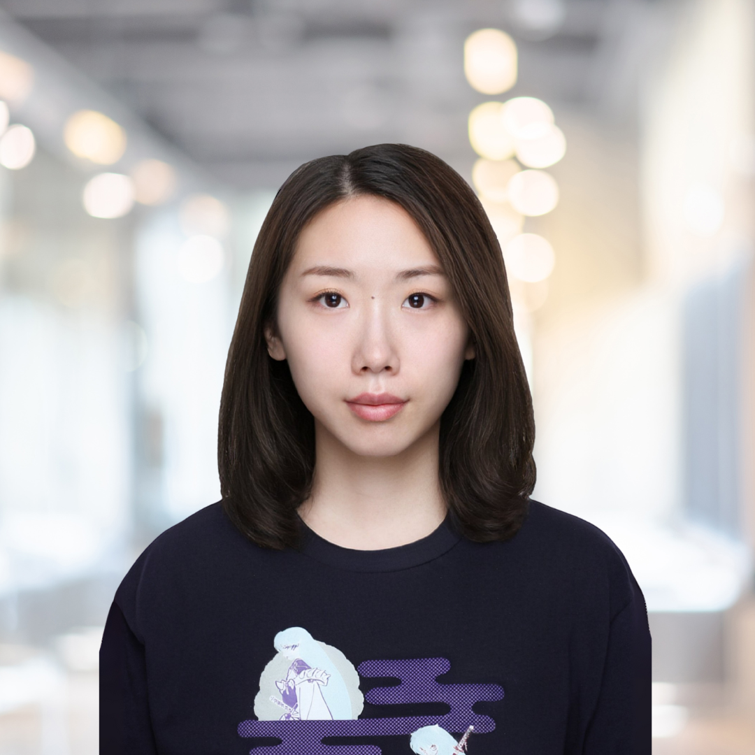 Headshot of Shan Du, an Asian woman with shoulder-length brown hair, wearing a black shirt.