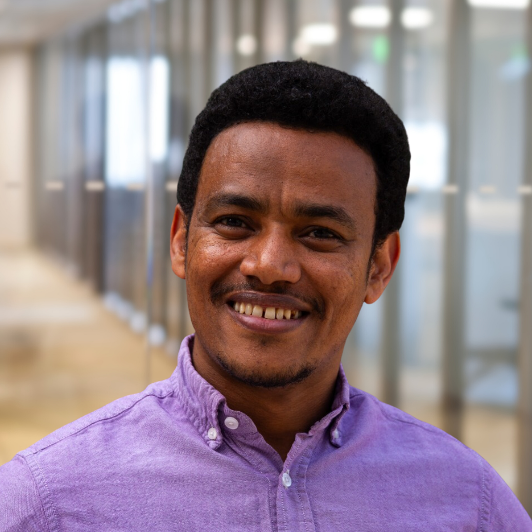 Headshot of Toli Amare, smiling.