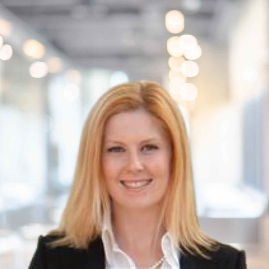 Headshot of Amy Sommer, a smiling woman with long, blonde hair, wearing a black blazer.