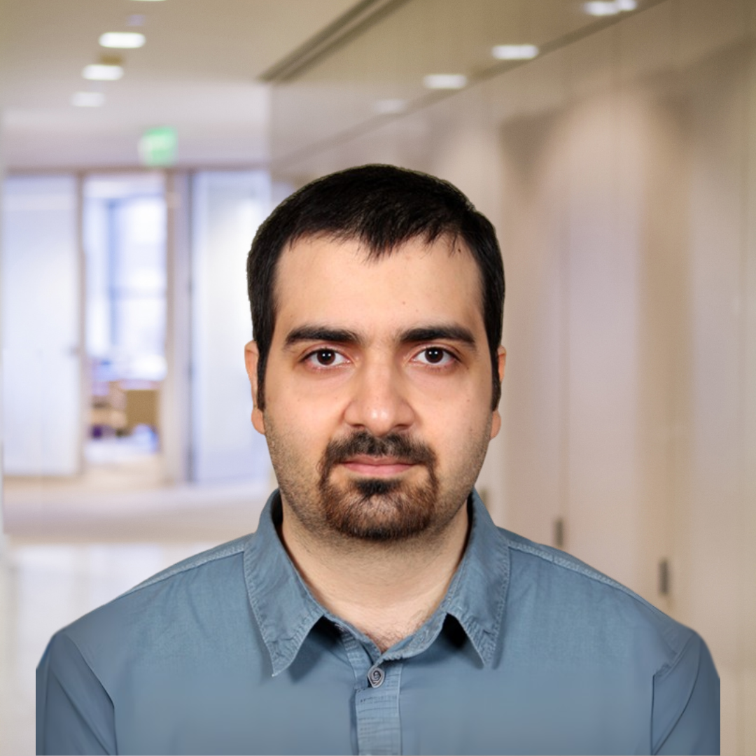 Headshot of Mohammad Gheidi, a man with short, dark hair, a goatee, wearing a steel blue shirt.