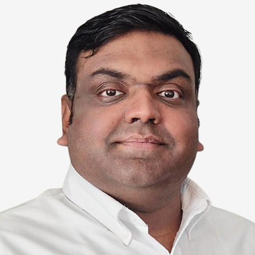 Headshot of Syed Omar Alam, a smiling man with dark hair, wearing a white collared shirt.